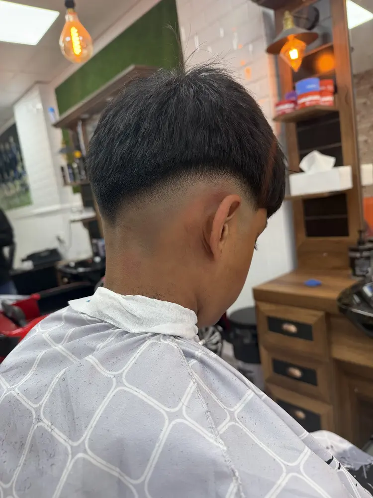 Back of a client's head showing a freshly blended skin fade